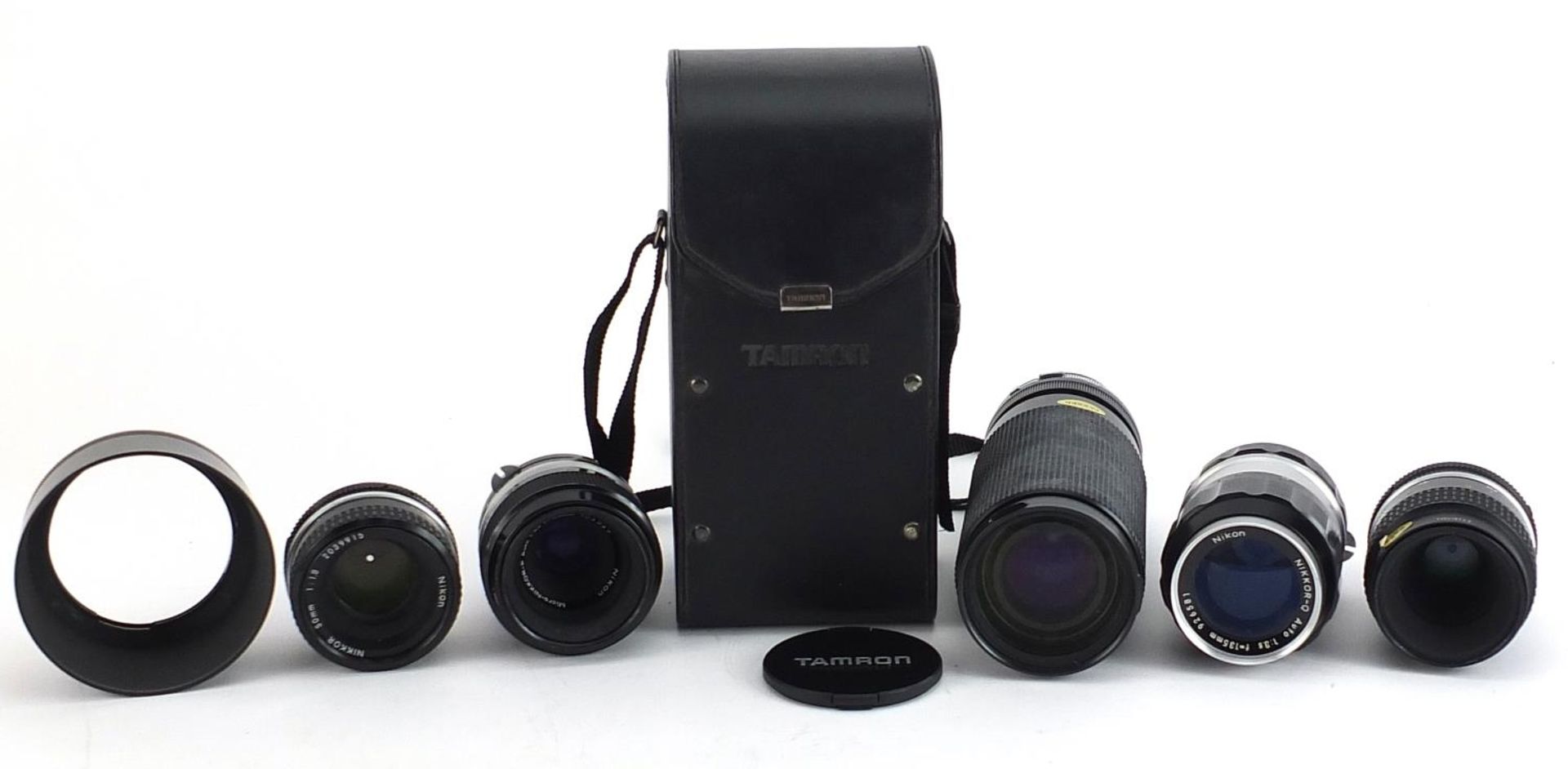 Five camera lenses comprising Tamron 60-300mm with case and four Nikon Nikkor 135mm, 55mm, 55mm