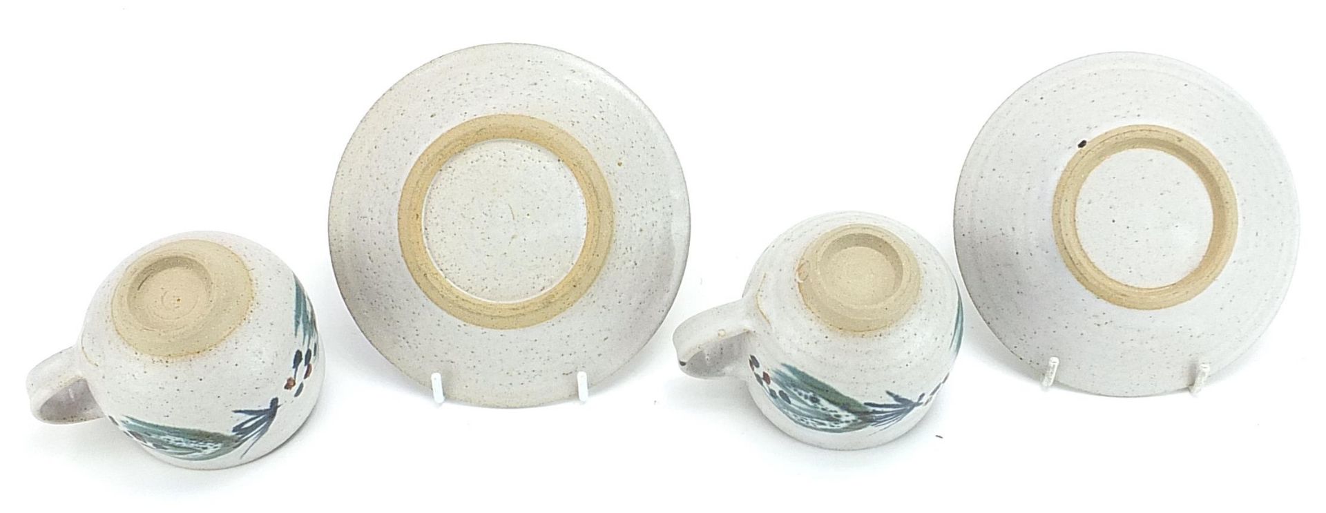 Marianne de Trey, pair of studio pottery cups and saucers hand painted with stylised motifs, - Image 3 of 3