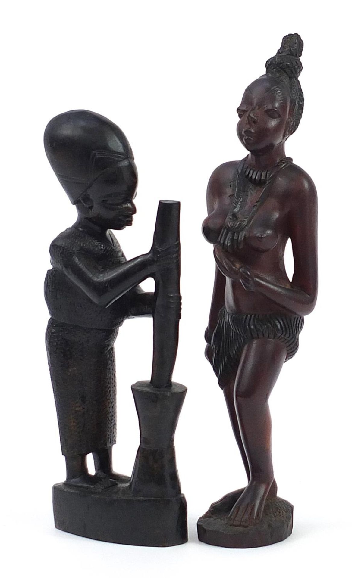 Two African hardwood carvings of tribespeople including a nude female, the largest 40cm high