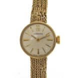 Garrard, ladies 9ct gold wristwatch with 9ct gold strap, 17mm in diameter, total weight 16.5g