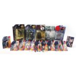 Action figures with blister packs including Star Wars, X-Files and Matrix