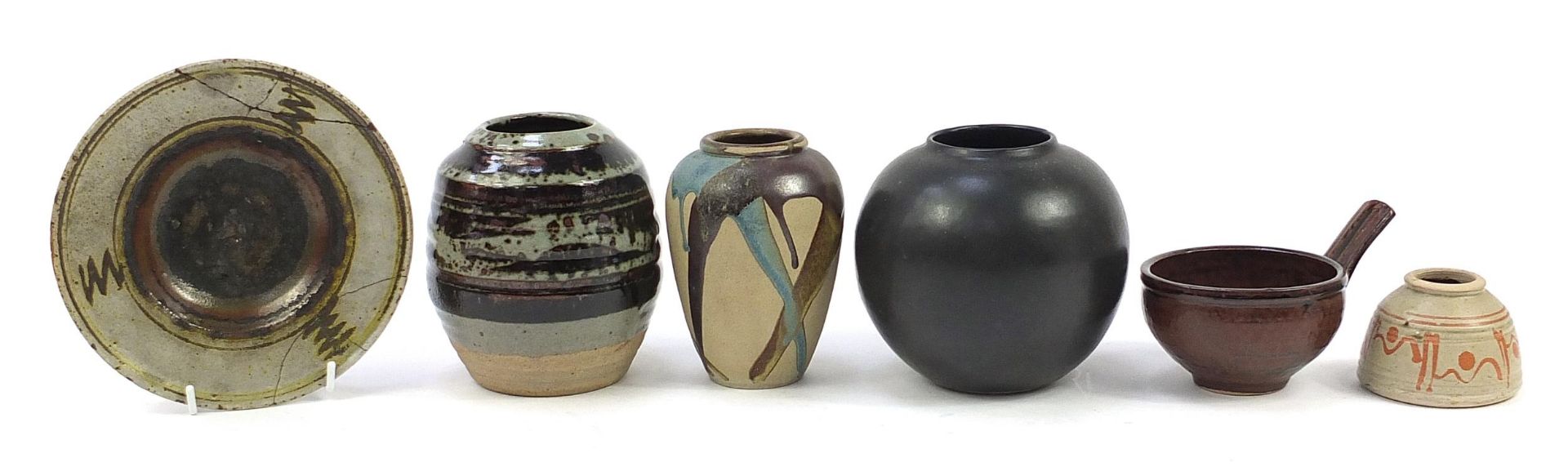 Studio pottery including a Michael Leach handled bowl and vase, possibly by Phil Rogers, the largest