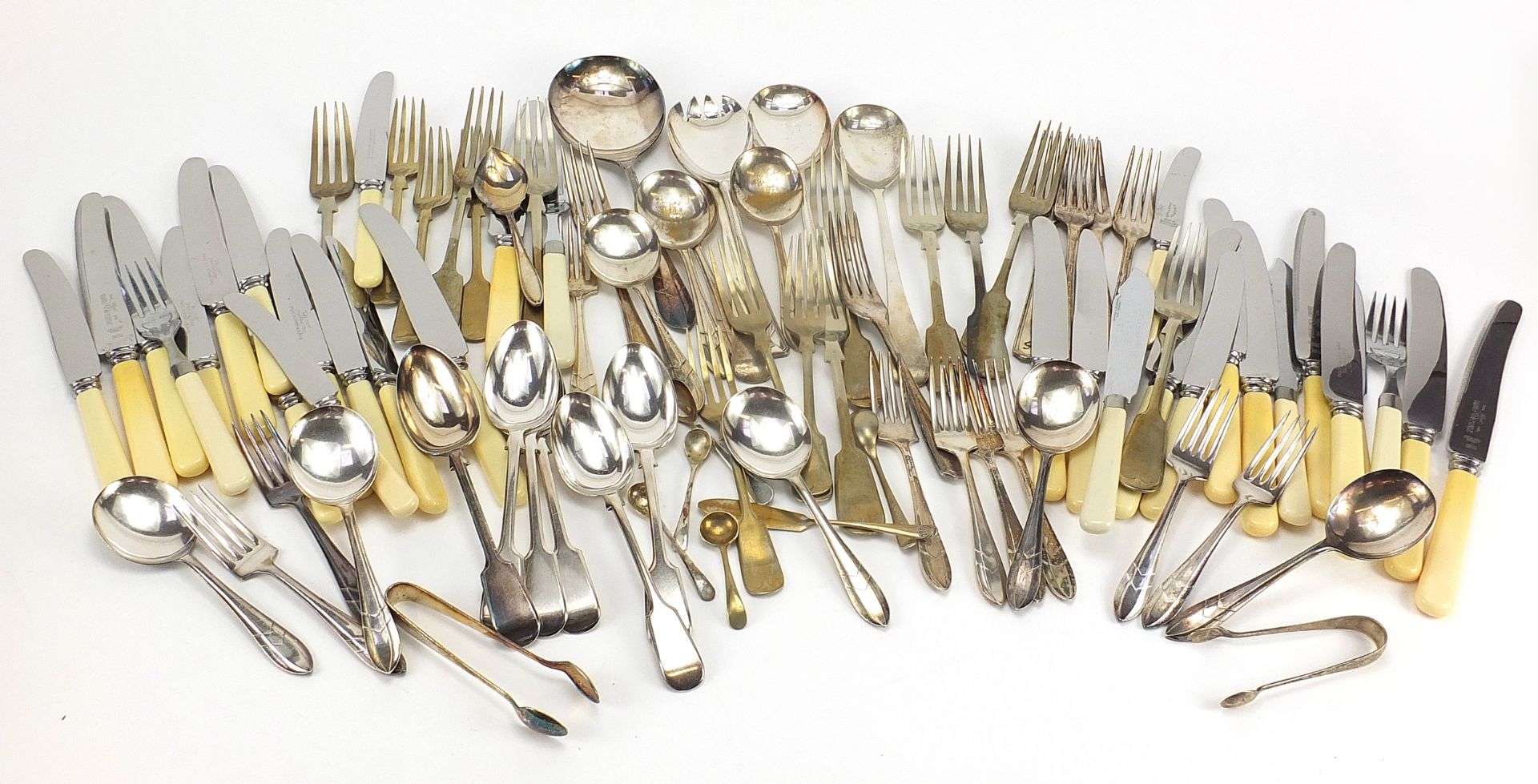 Silver plated and stainless steel cutlery, some with ivorine handles and a pair of silver sugar ton