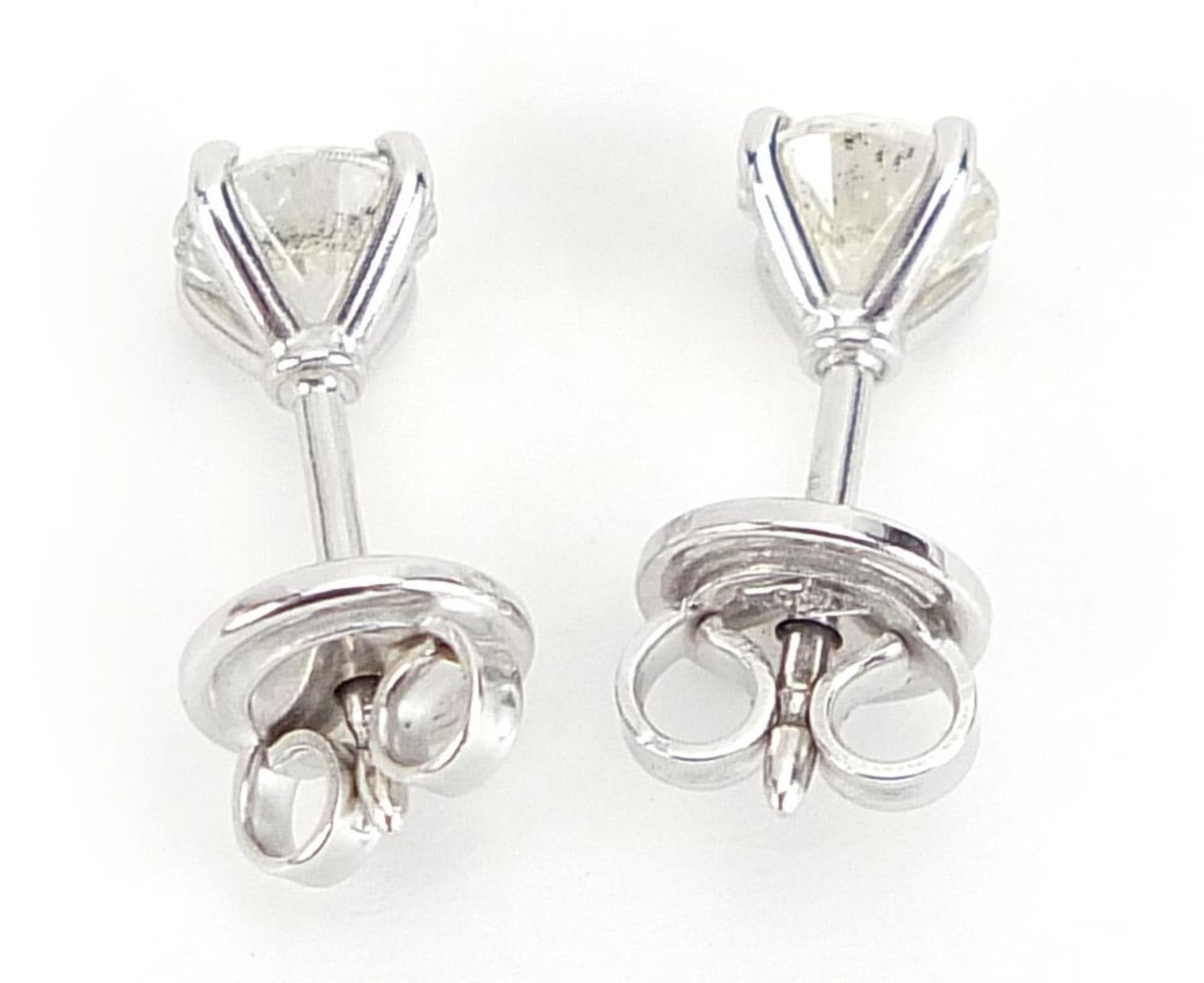Pair of 18ct white gold diamond solitaire stud earrings, total diamond weight approximately 1.04 - Image 2 of 5