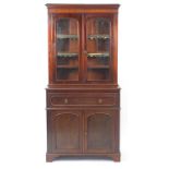 Mahogany secretaire bookcase with pair of glazed doors above drawer with fitted interior and pair o