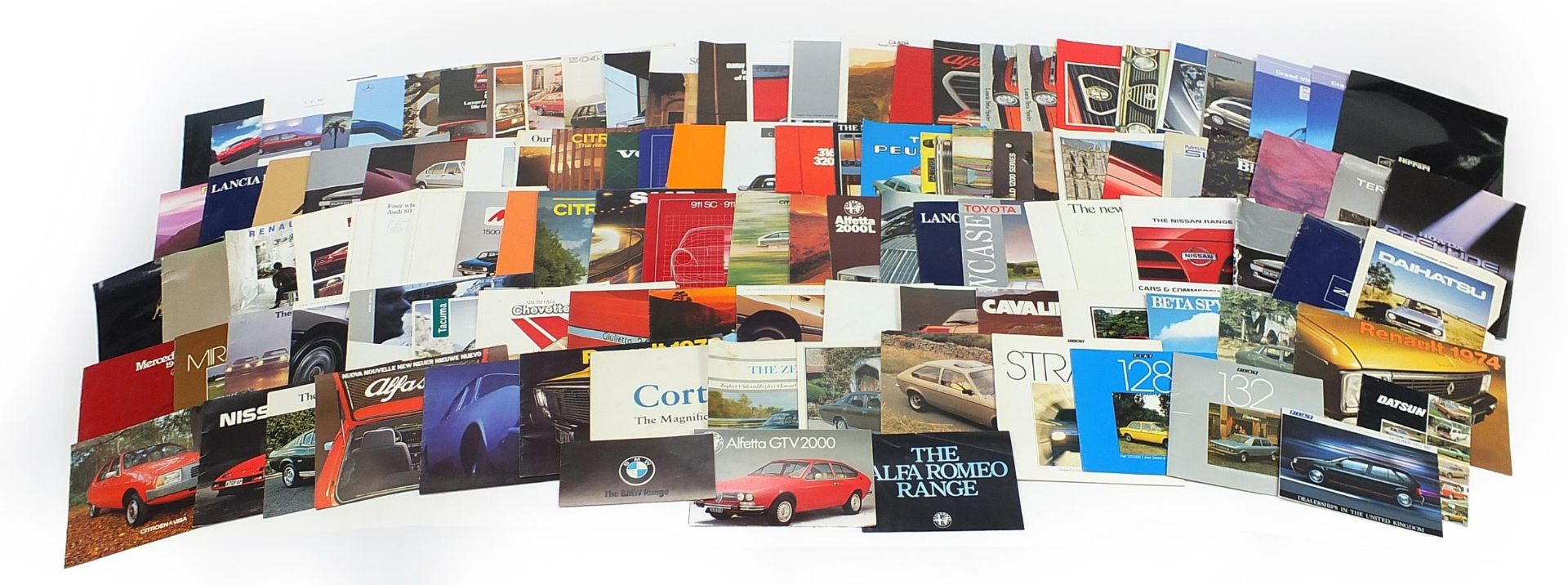 Collection of vintage and later car sales pamphlets including Rolls Royce, Lamborghini, Porsche,