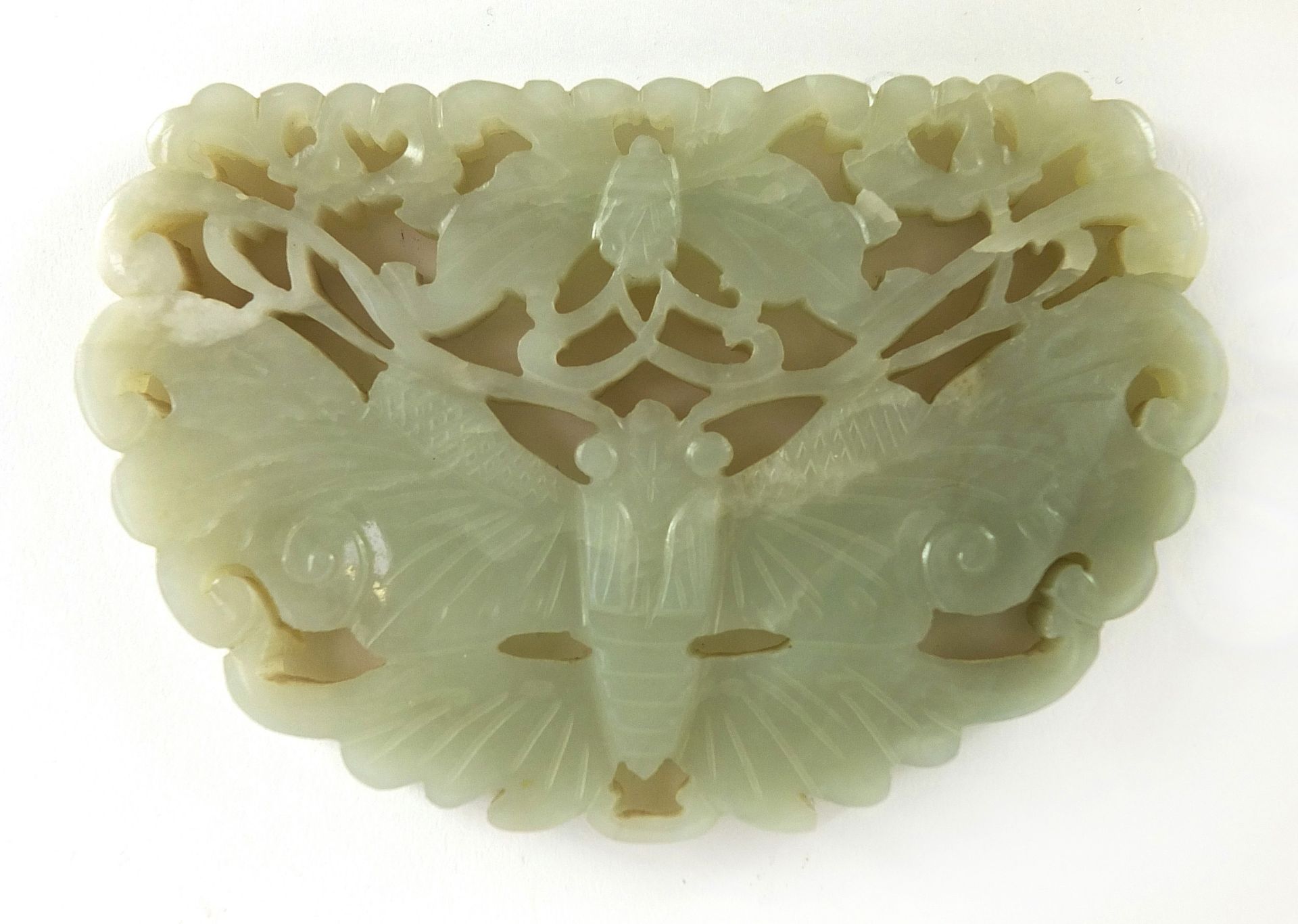 Chinese celadon and russet jade panel carved with two butterflies raised on carved hardwood stand, - Image 5 of 8