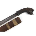 Middle Eastern Javanese Wedung knife with carved head horn handle and wooden sheath, the handle