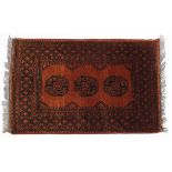 Middle Eastern rectangular brown ground rug having an all over geometric design, Knecht A G label to