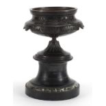 19th century Grand Tour patinated bronze urn with a circular marble base, 20.5cm high