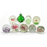 Eight colourful glass paperweights and a scent bottle with stopper, the largest 11cm high