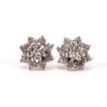 Pair of unmarked gold diamond flower head stud earrings, 1.2cm in diameter, 3.0g