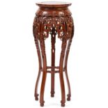 Chinese carved hardwood plant stand, 87cm high