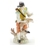 Dresden, German porcelain figure of a shepherd with lamb, 21.5cm high