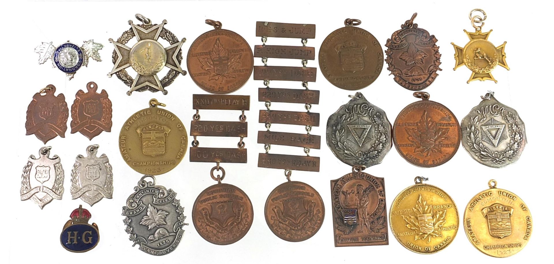 Predominantly athletic jewels and medallions, some silver including standing high jump awarded to