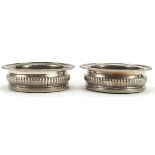 Thomas & James Creswick, pair of George III demi fluted circular silver and oak wine coasters,