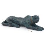 Large pottery model of a recumbent leopard, 60cm in length