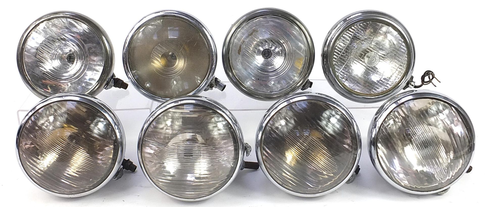 Eight vintage Joseph Lucas King of the Road motor vehicle headlamps, type 148, some with Lucas glass