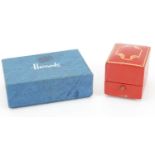 Red Cartier ring box together with a blue Harrod's cardboard jewellery box, the largest 7cm x 5cm