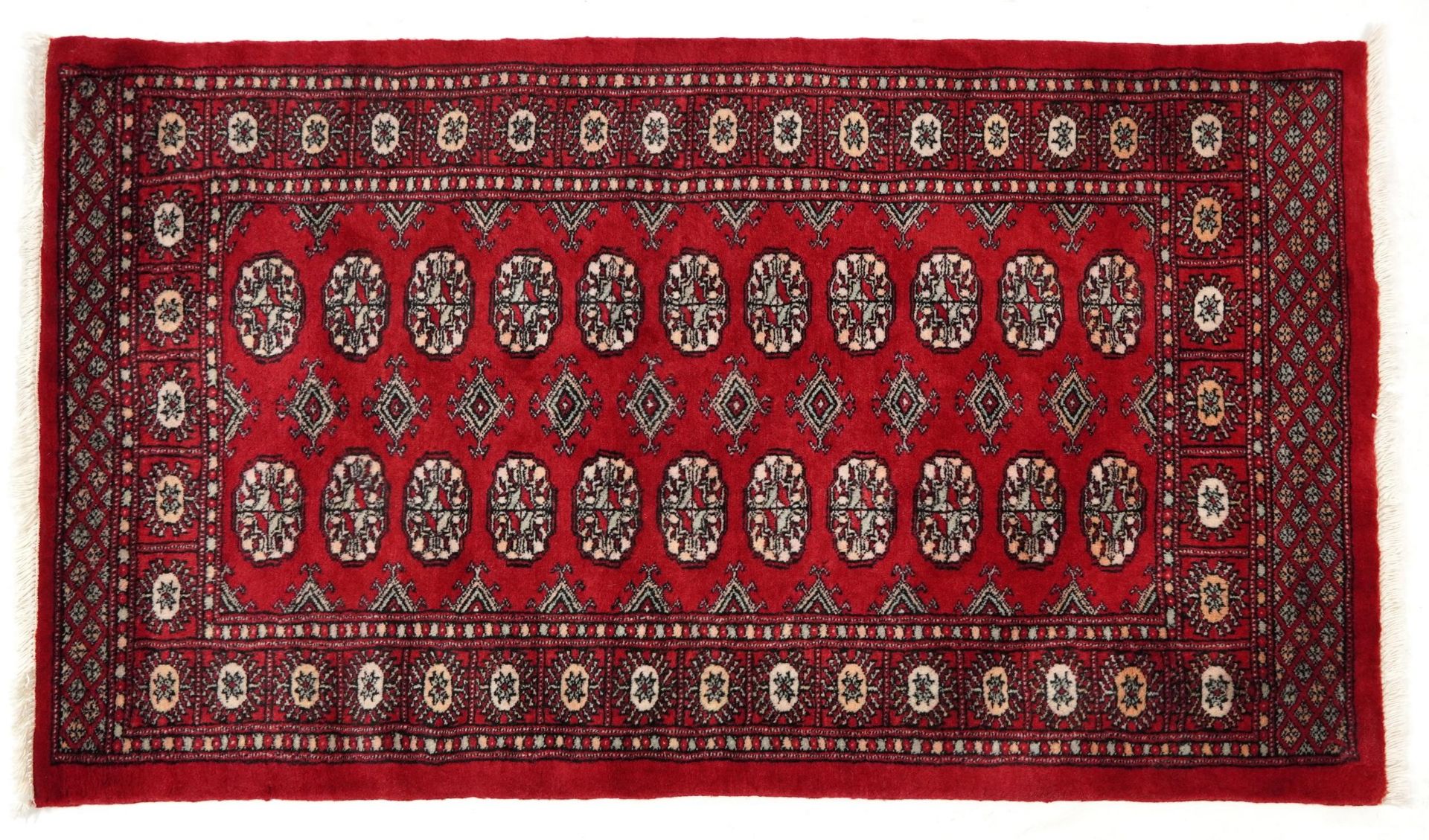Rectangular Bokhara red ground rug having an all over geometric design, 154cm x 96cm
