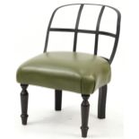 Industrial style wrought iron chair with green leather upholstered seat on turned mahogany legs,