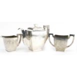 Asian white metal three piece tea service engraved with flowers and swags, possibly Chinese or