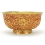 Chinese gilt bronze footed bowl cast with dragons amongst clouds chasing flaming pearls, four figure