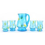 Blue glass lemonade jug and four glasses, the jug 20cm high