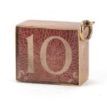 9ct gold emergency ten shilling note charm, 1.2cm high, 2.9g