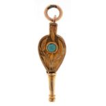 Unmarked gold cabochon turquoise fire bellows charm with engraved decoration, 2.5cm high, 1.0g
