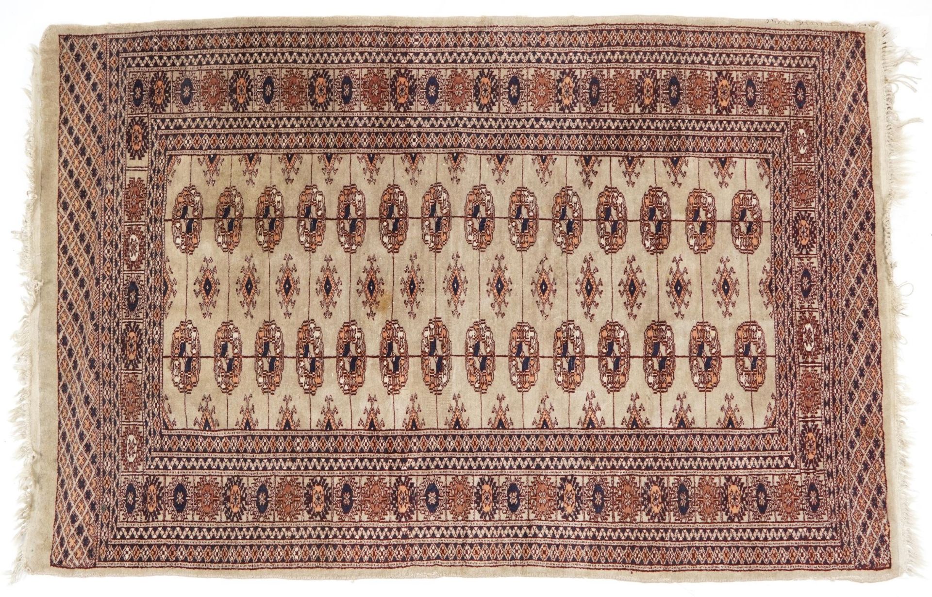 Rectangular Bokhara part silk cream and blue ground rug having an all over geometric design, 150cm x