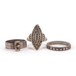 Three silver rings comprising a buckle design example and two set with marcasite, size N, M and Q,