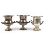 Three silver plated wine coolers with twin handles, two with presentation inscriptions, the