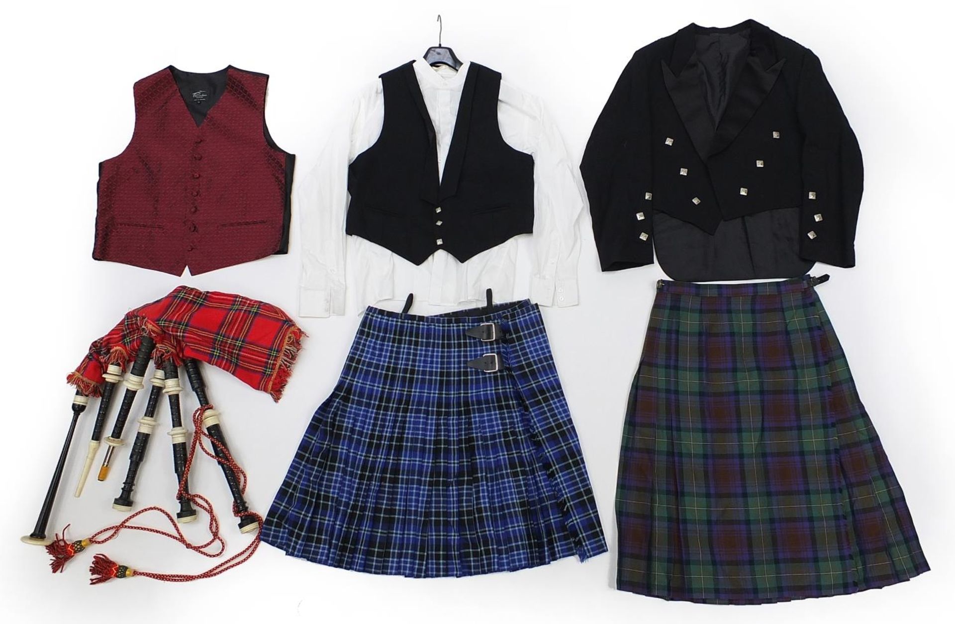 Set of Scottish bagpipes with two kilts and a suit