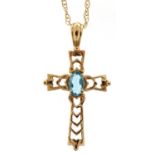 Unmarked 9ct gold blue topaz cross pendant on a 9ct gold necklace, 2.7cm high and 46cm in length,