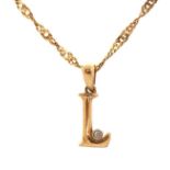 9ct gold initial L pendant set with a diamond on a 9ct gold rope twist necklace, 1.5cm high and 45cm