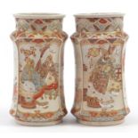 Pair of Japanese Satsuma pottery vases hand painted with seated figures, 25cm high