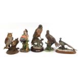 Five Capodimonte bird sculptures, two with certificates including eagle, owls and heron, the largest