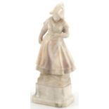Carved alabaster sculpture of a Dutch girl, indistinctly signed to the base, 28.5cm high