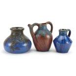 Two Bourne Denby jugs including a spouted example and an Art Nouveau example with pewter overlay,