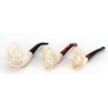 Three Meerschaum style pipes, the largest 16cm in length