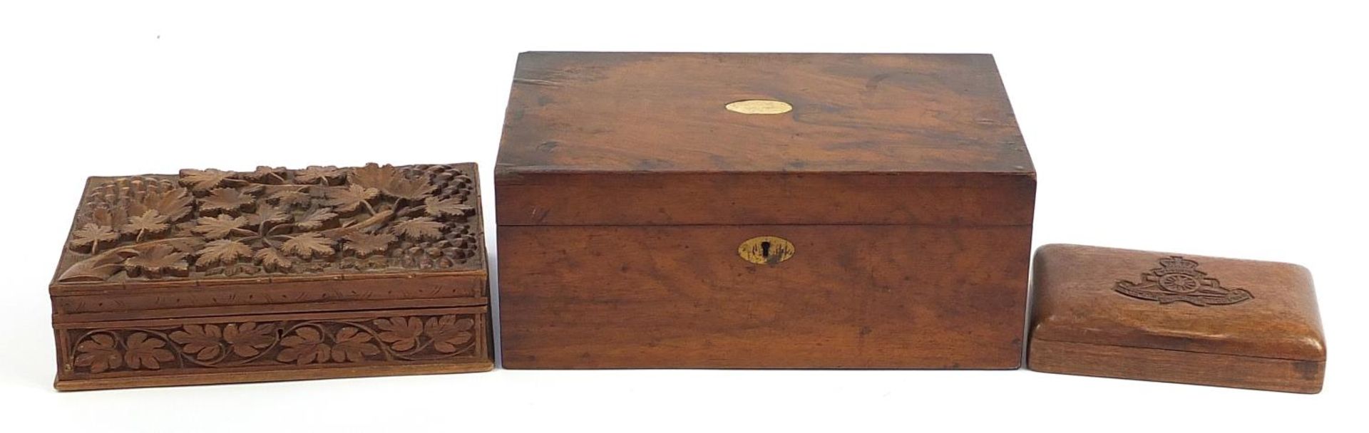 Three wooden boxes including Victorian walnut writing slope and one carved with a Royal Artillery Cr