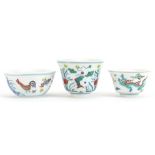 Three Chinese doucai porcelain tea bowls including one hand painted with chickens, various character