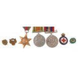 British military World War II three medal group and four badges including British Red Cross Society