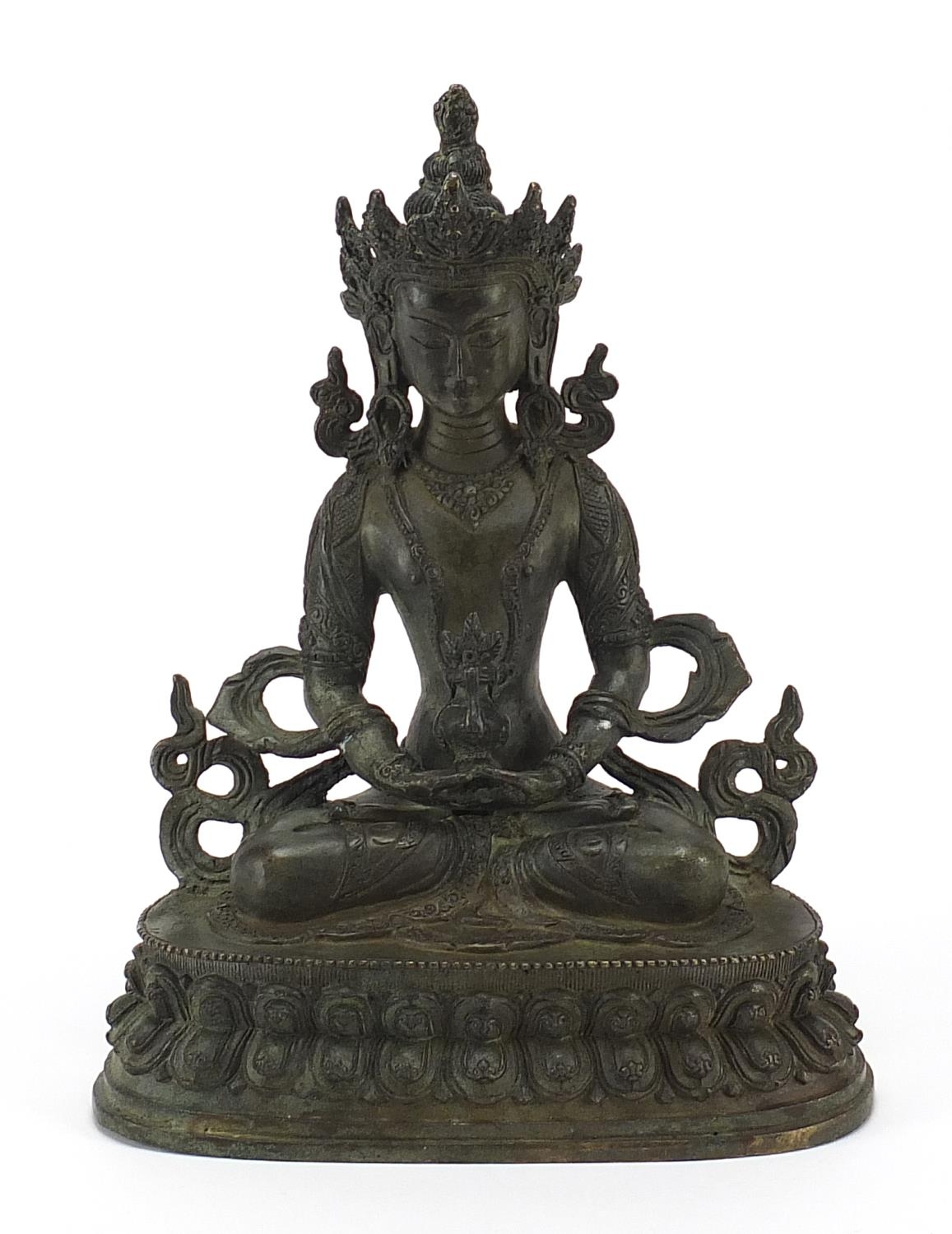 Chino Tibetan patinated bronze figure of seated Buddha, 29.5cm high