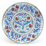 Turkish Iznik pottery plate hand painted with flowers, 31.5cm in diameter