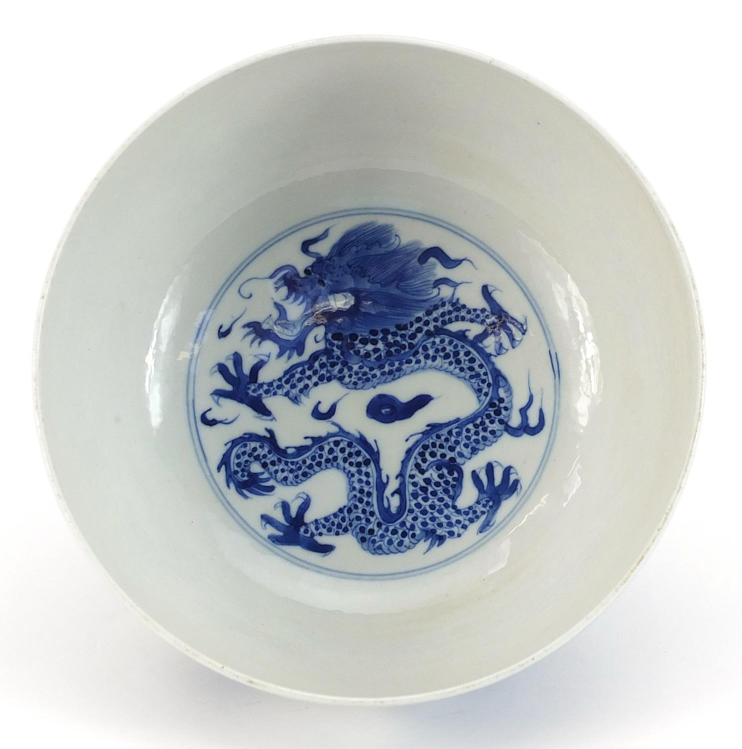 Chinese blue and white porcelain bowl hand painted with dragons chasing a flaming pearl amongst - Image 3 of 4