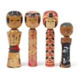 Four Japanese Kokeshi dolls, the largest 31cm high
