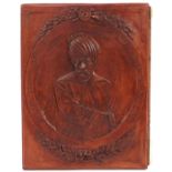 Rectangular terracotta plaque decorated in relief with a Sultan, 40cm x 30.5cm
