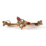 Victorian 9ct gold butterfly brooch set with seed pearls, opals and red stones housed in a tooled